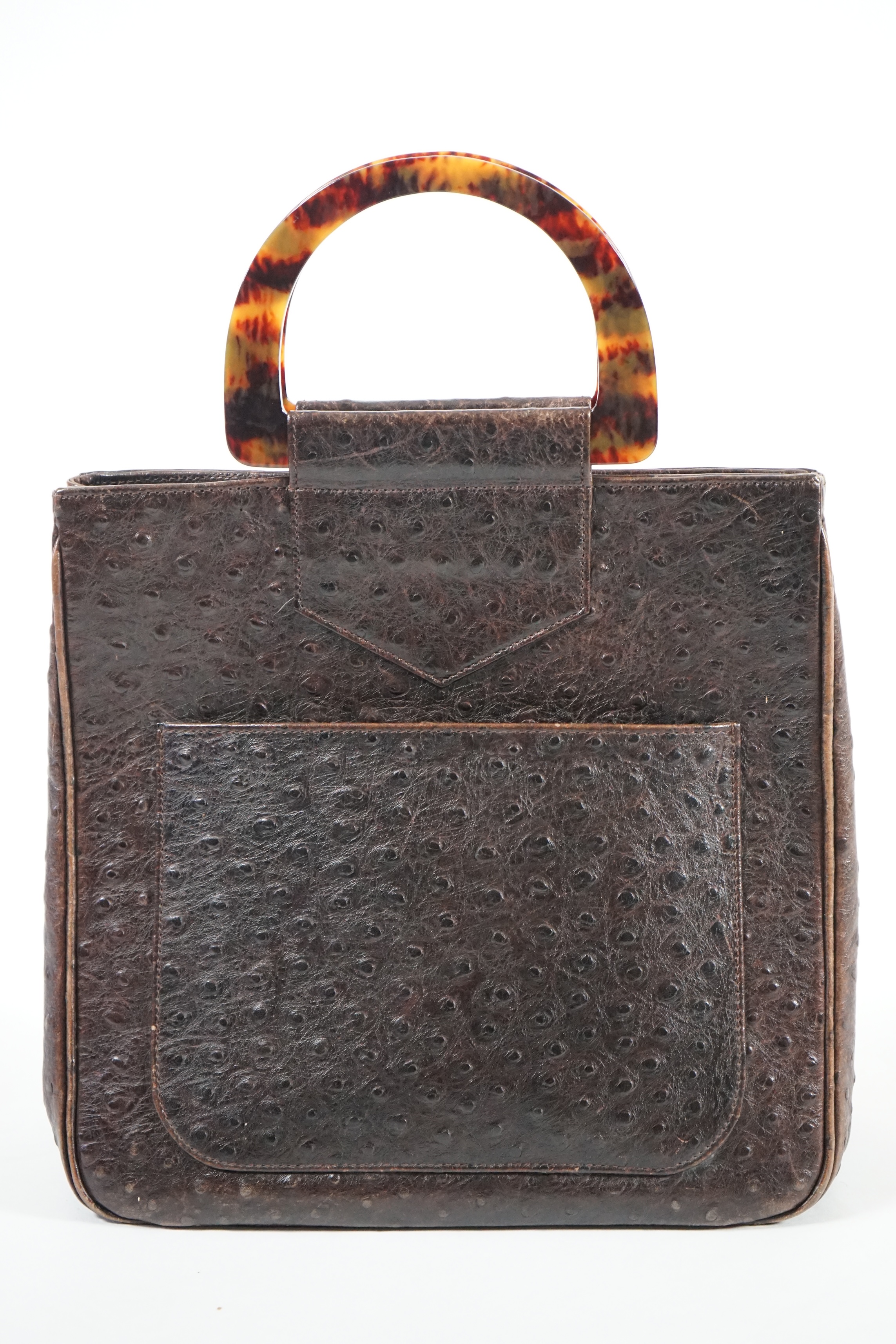 A brown Yves Saint Laurent handbag with faux tortoiseshell handles, ostrich leather with interior zip pocket